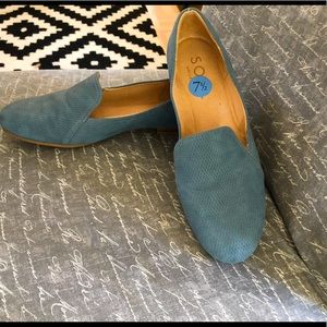 Blue suede loafers.
